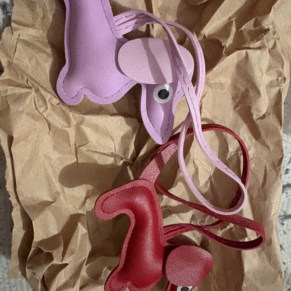 Pink and Red Animal-Shaped faux leather dogs for bag charms and or key chains.